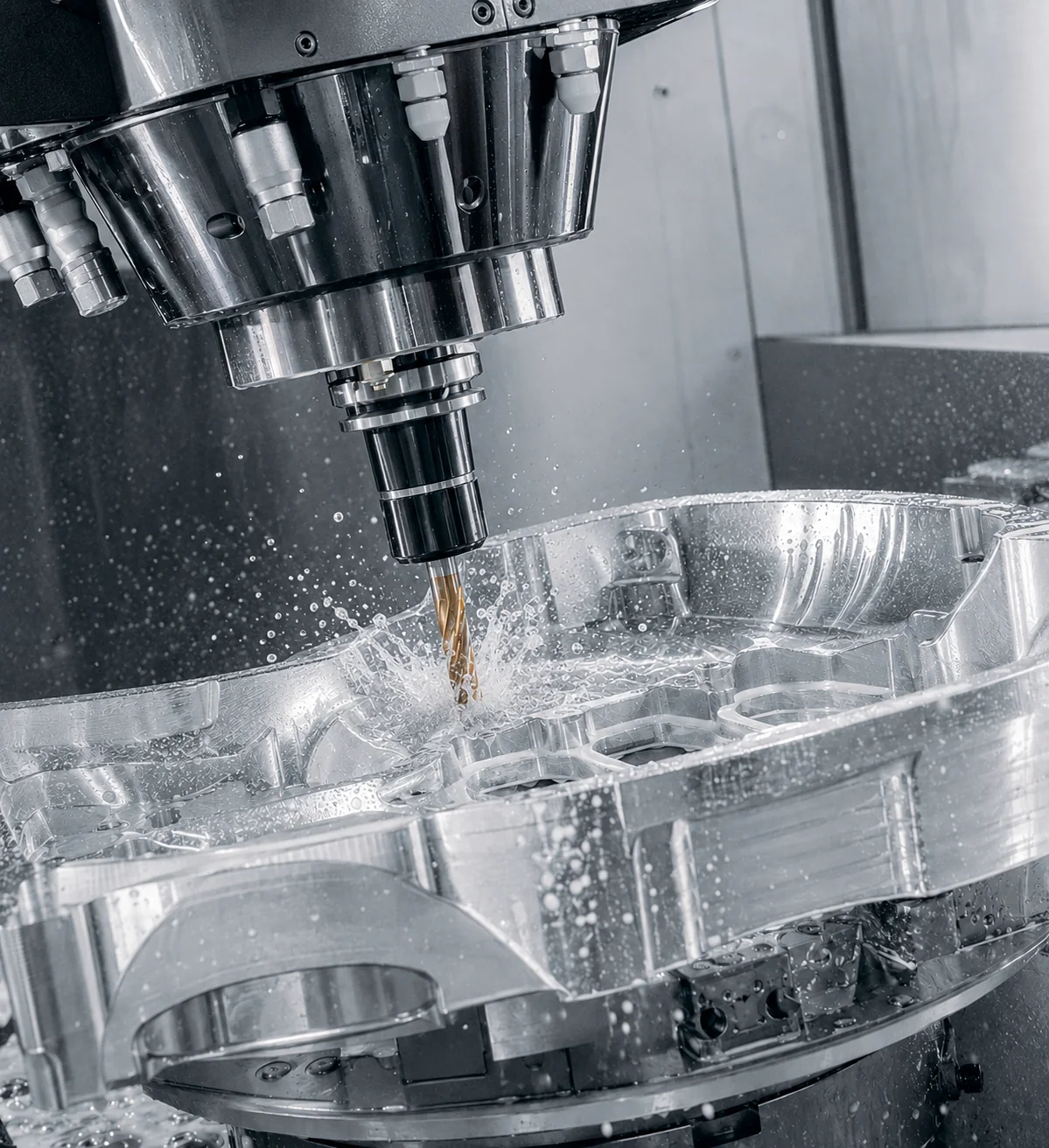 Precision CNC machining center actively cutting an aluminum component